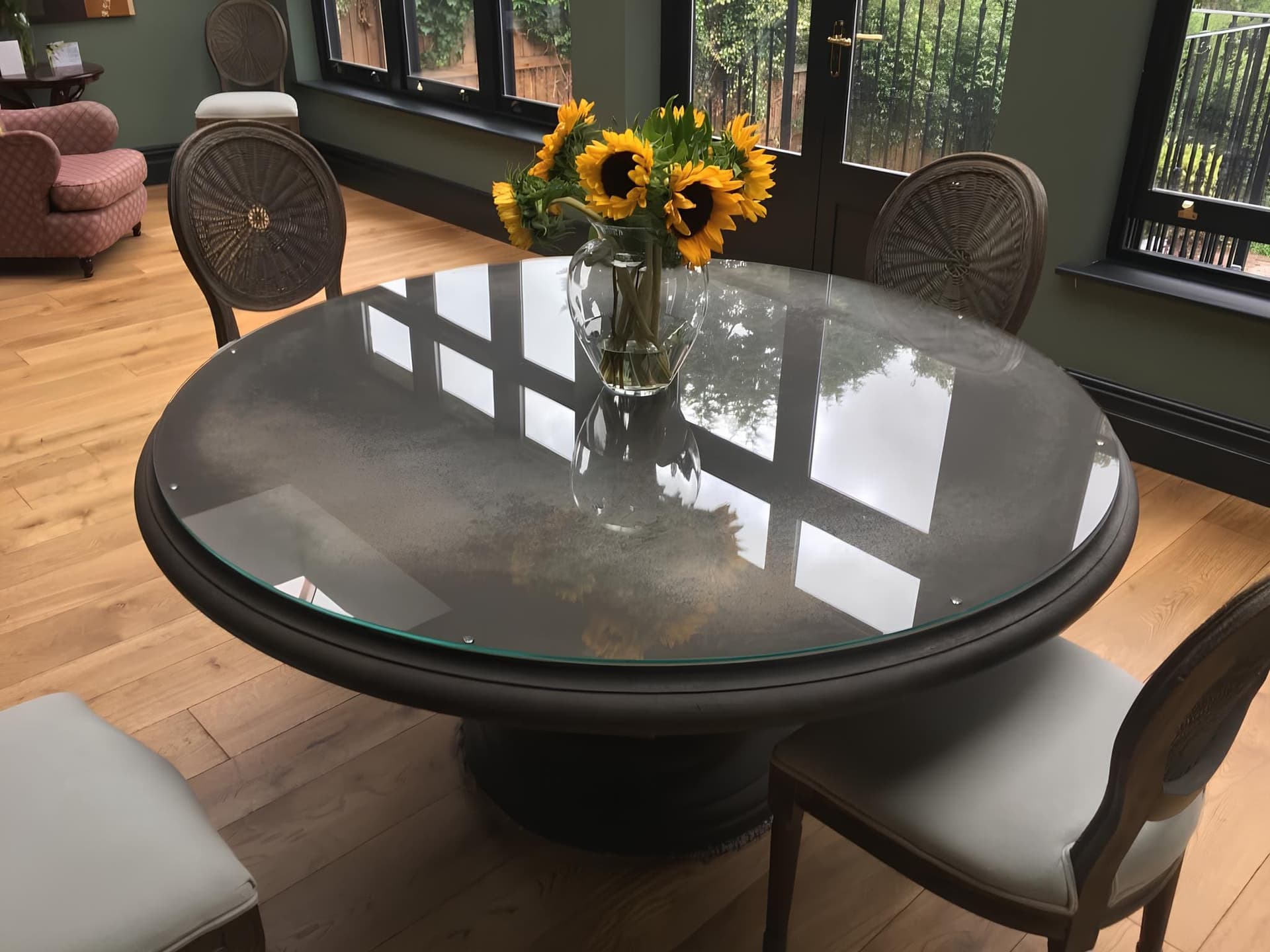 Clear glass top on a round dining table