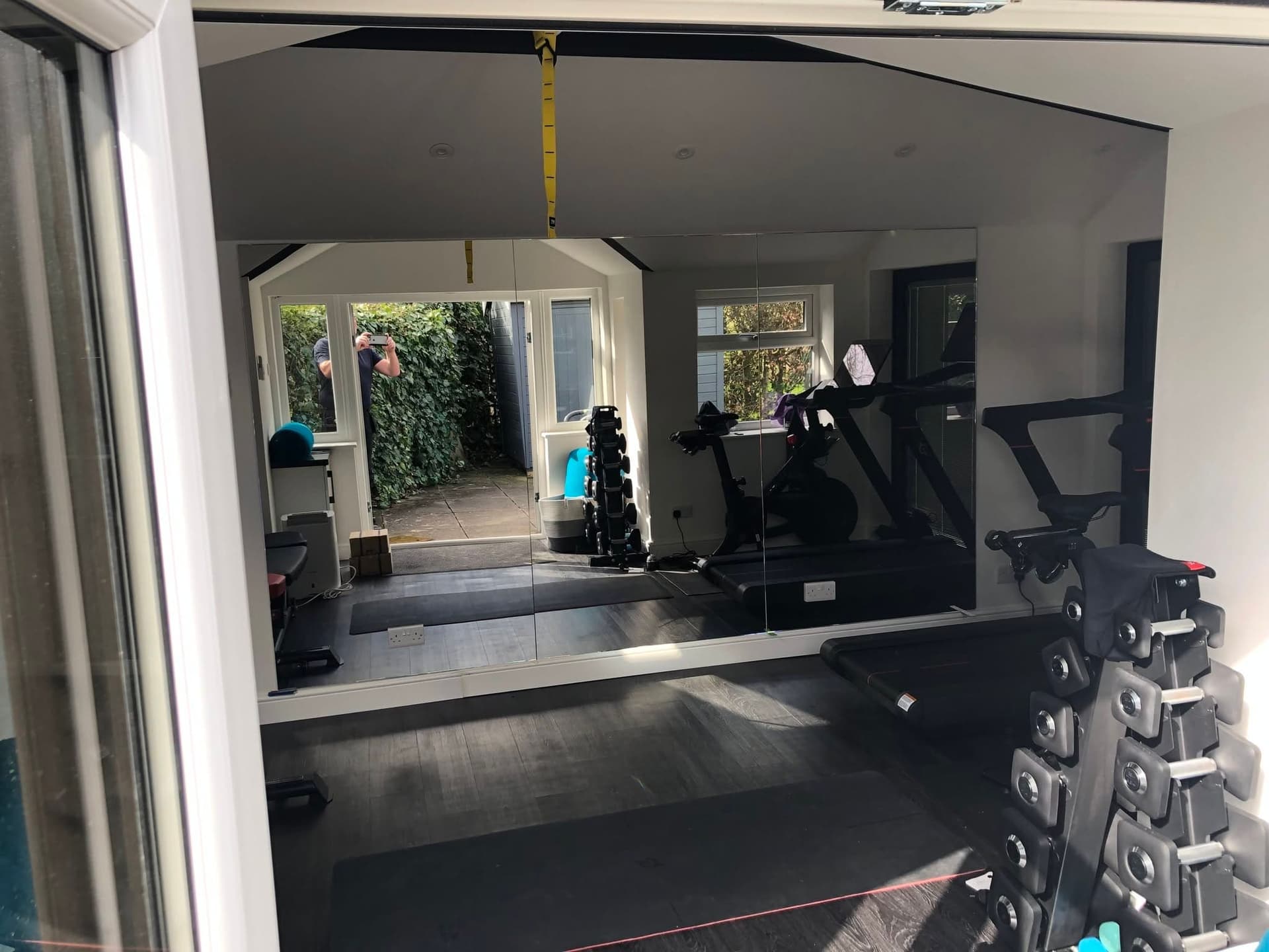 Full-width mirror wall in a home gym
